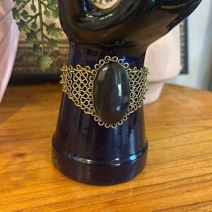 Vintage gold tone bracelet with large black stone- used